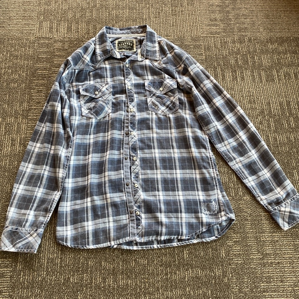 Blue plaid snap button shirt.
